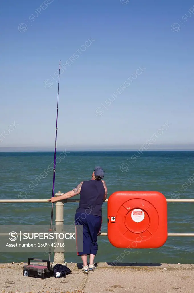 England, East Sussex, Hastings, Fisherman and Fishing Rod