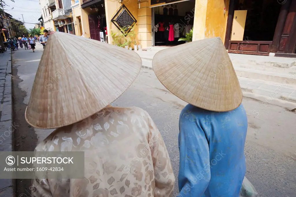 Vietnam, Hoi An, Women Walking with Conical Hats and Traditional Costume