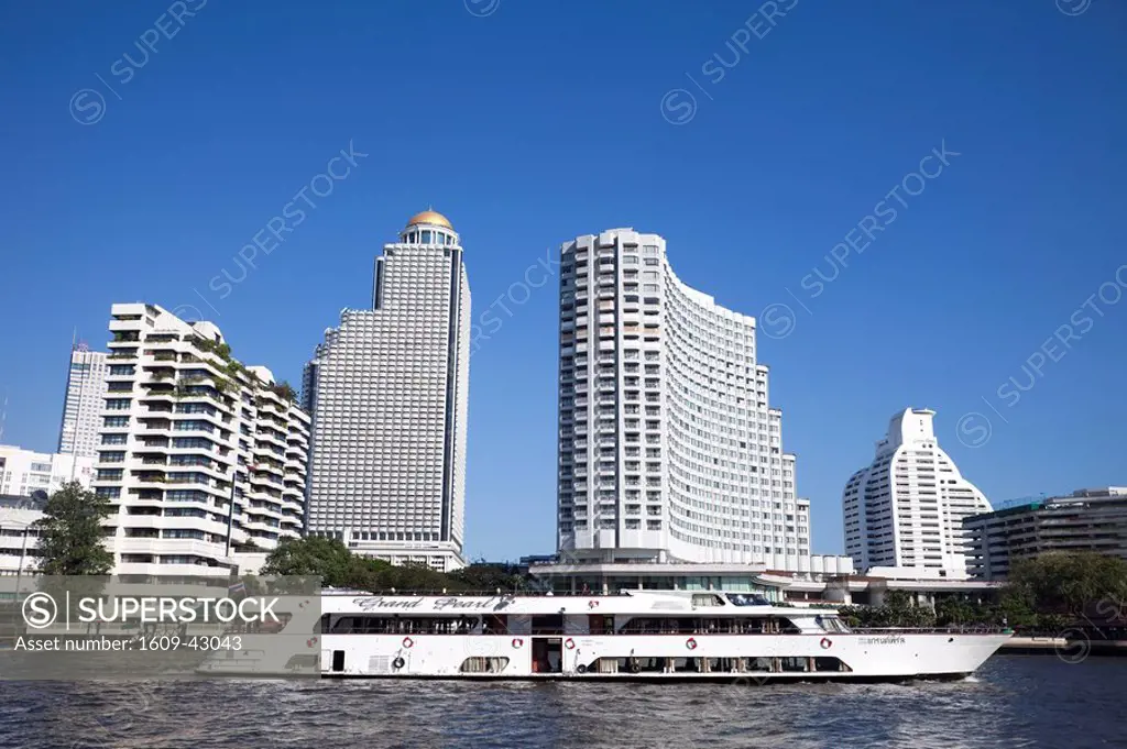 Thailand, Bangkok, Cruise Boat and City Skyline on Chao Phraya River