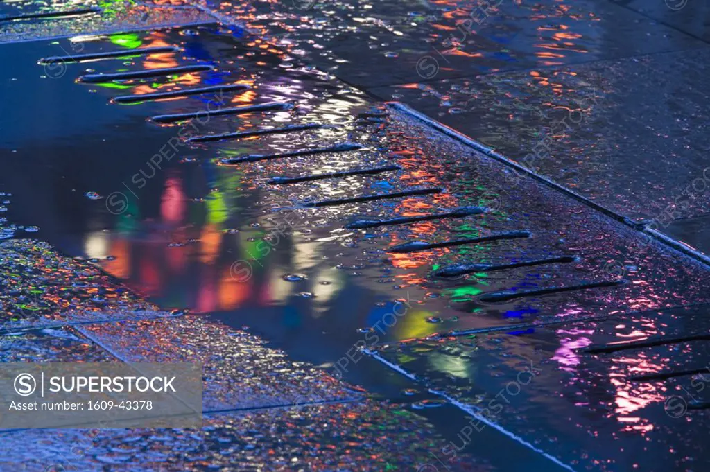 Lights reflected in puddle, South Bank, London, England