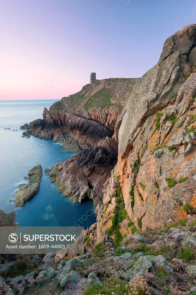 WWII German Observation tower and the rocky northwest coastline of Jersey, Channel Islands, UK