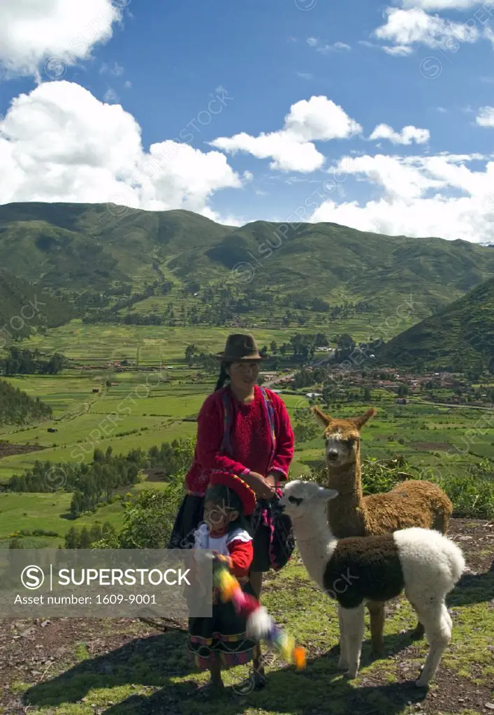 Woman and child with Lamas, Peru