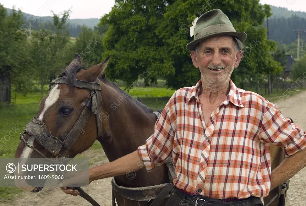 Man with horse, Moldavia, Romania