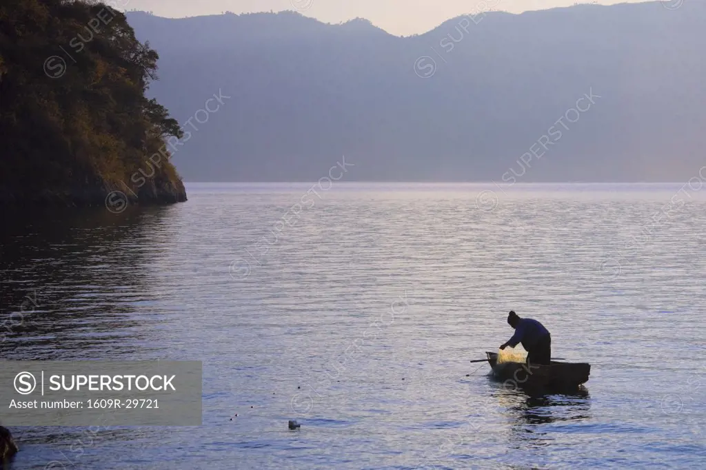 Fisherman at dawn, Lake Atitlan, Guatemala