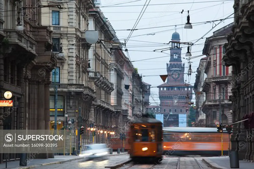 Italy, Lombardy, Milan, Milan trams on Via Orefici with Castello Sforzesco