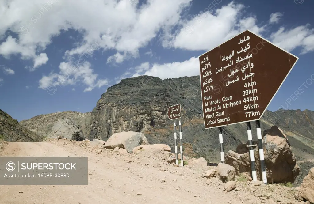 Oman, Western Hajar Mountains, Balad Seet, Dirt Road and Signposts to Ar Rustaq