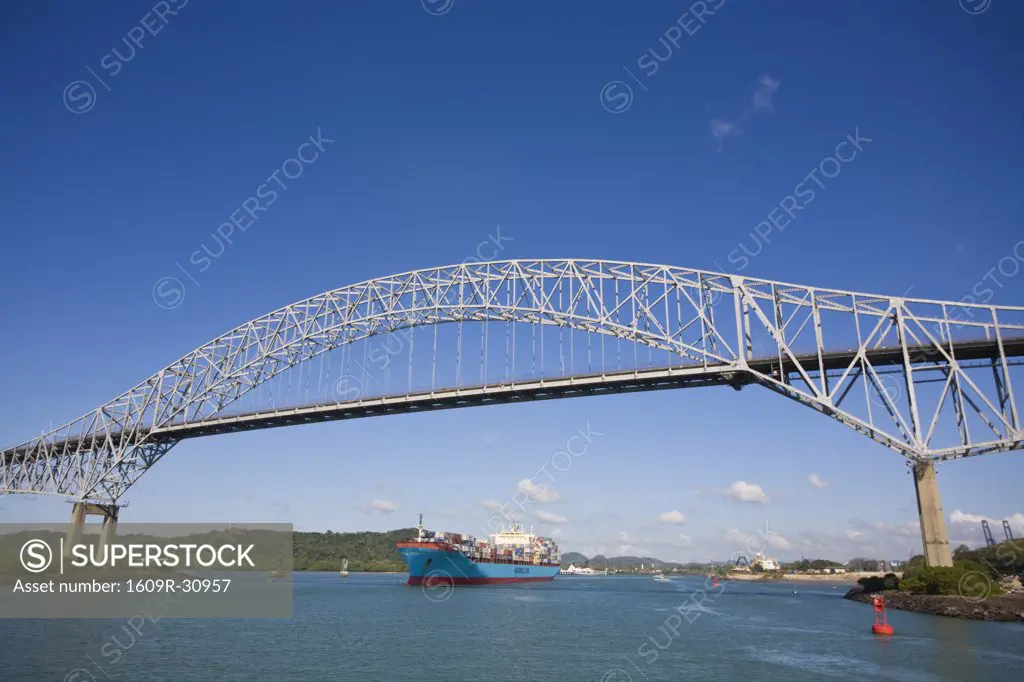 Panama, Panama city, Container ship sailing under the Bridge of the Americas
