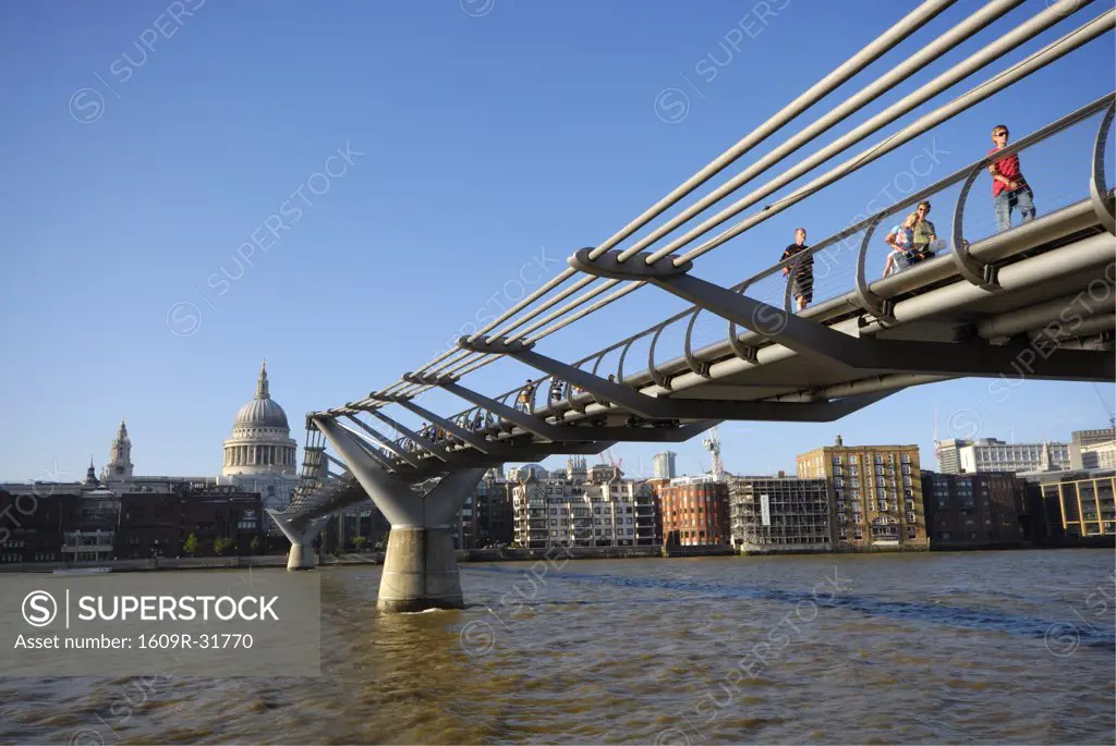 Millennium Bridge over River Thames and St. Pauls Cathedral, London, England