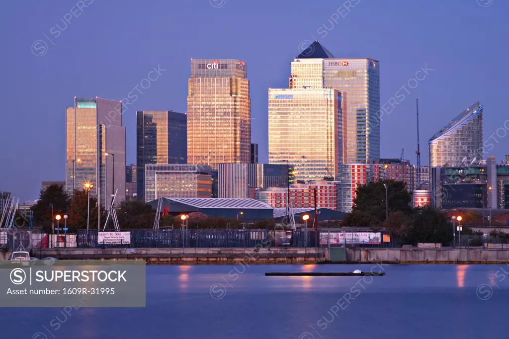 England, London, Newham,  Royal Victoria Docks, Canary Wharf buildings at dawn