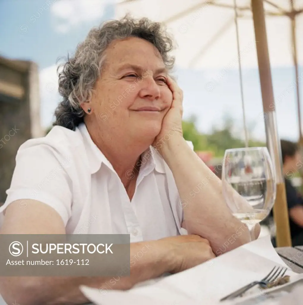 Close-up of a senior woman sitting in a restaurant