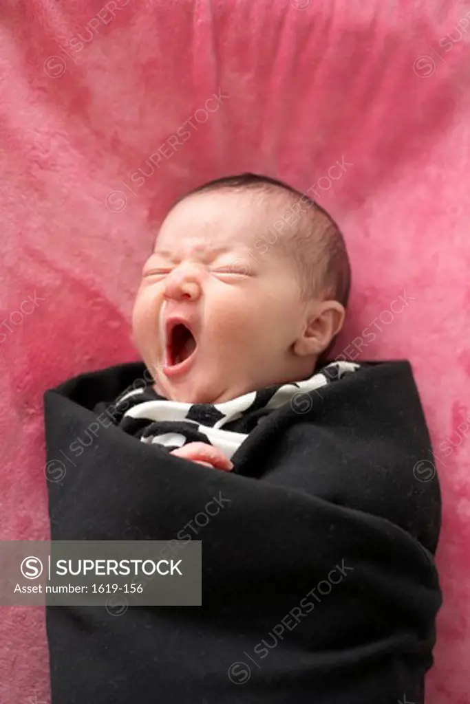 Close-up of a baby girl yawning