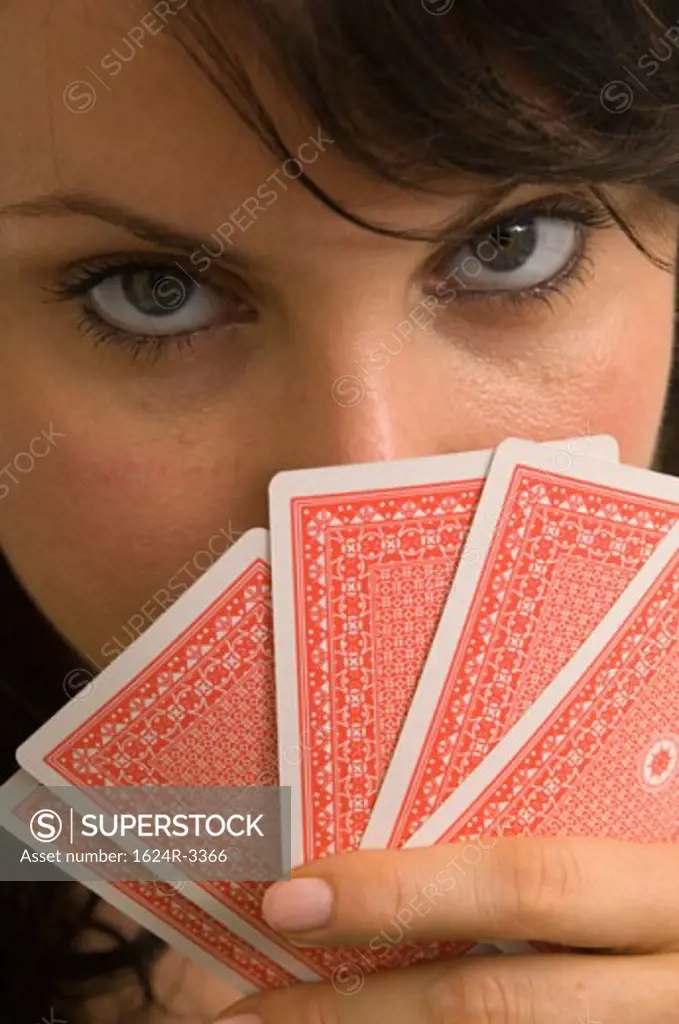 Extreme closeup of a woman playing poker.