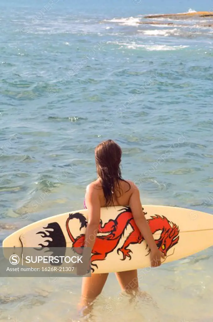 Girl with Dragon Surfboard Watching Waves