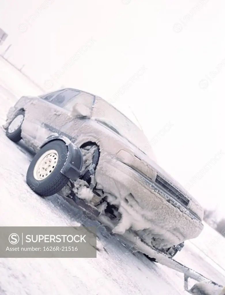 Snowy Car Being Towed