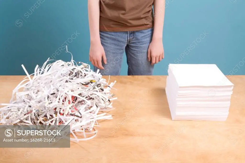 Teen with Pile of Shredded Paper