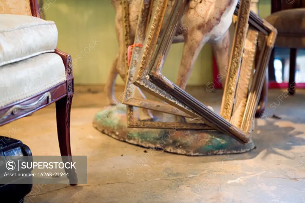 Antique Store Scene with Chair Leg and Frames