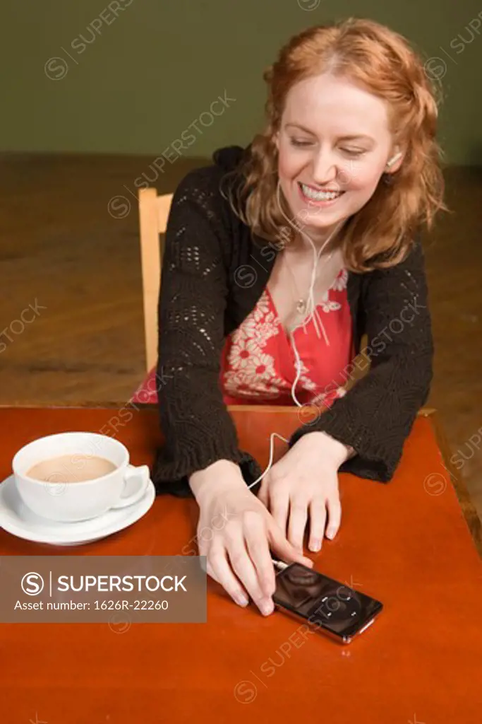 Young Woman with Headphones and Coffee