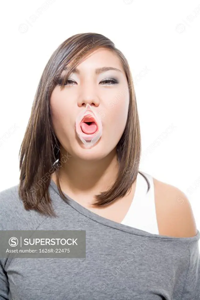 Attractive Young Woman with Popped Bubble Gum