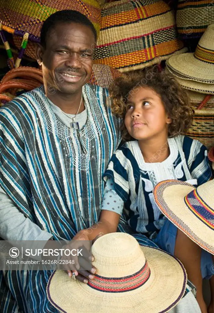 Father And Daughter With Hats And Baskets