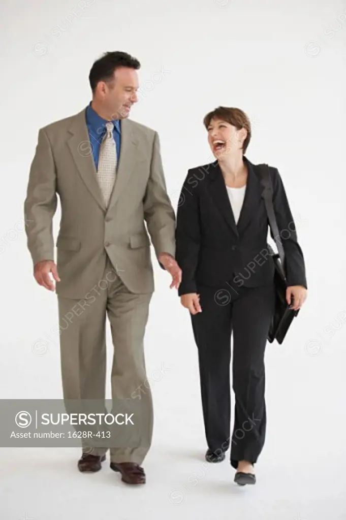 Businessman and a businesswoman walking