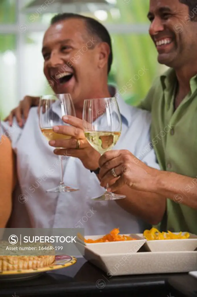 Close-up of two mature men enjoying a party