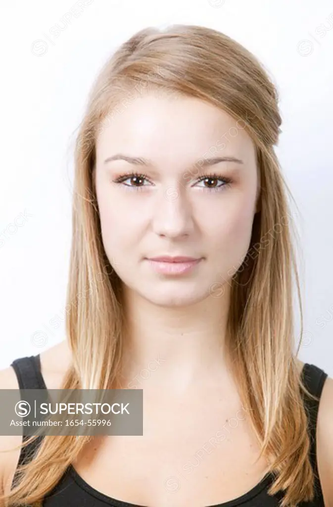 London, UK. Portrait of beautiful young woman against white background