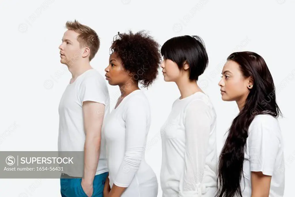 London, UK. Side view of young multi_ethnic friends in casuals standing in line over white background
