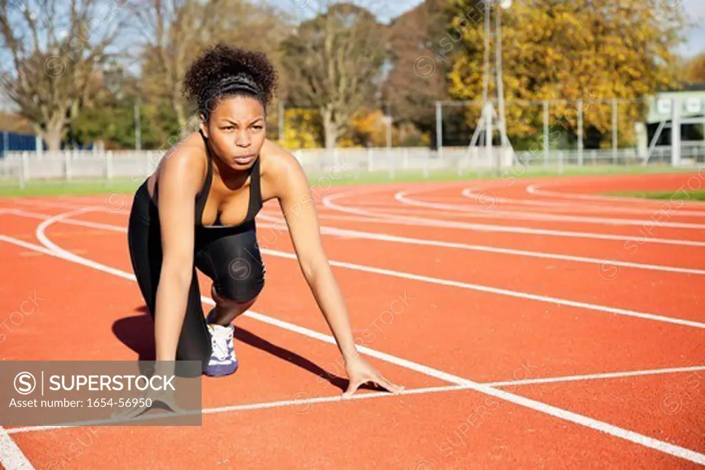 London, UK. African American female runner at the starting line