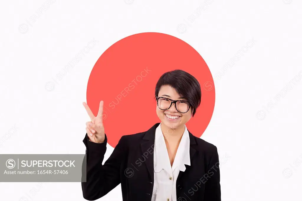 Portrait of young businesswoman gesturing peace sign over Japanese flag