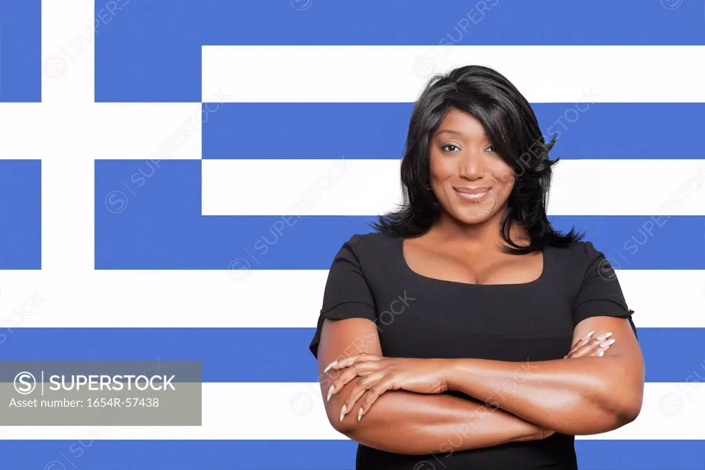 Portrait of casual mixed race woman against Greek flag