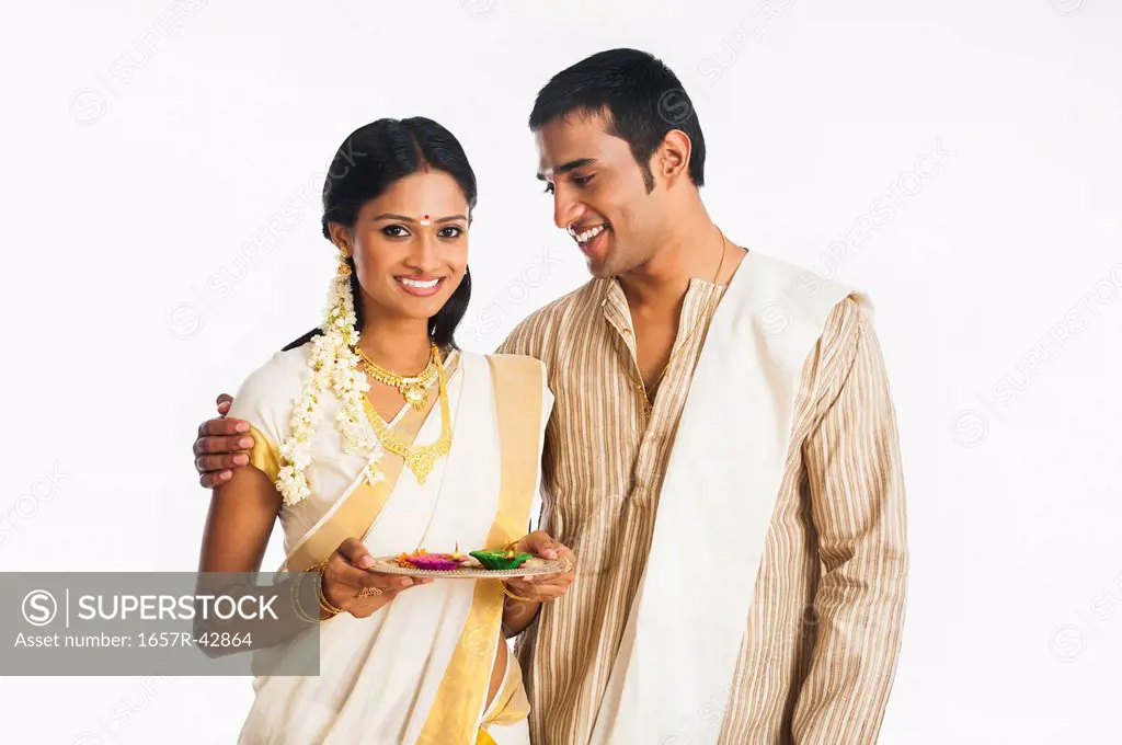South Indian couple smiling at Onam