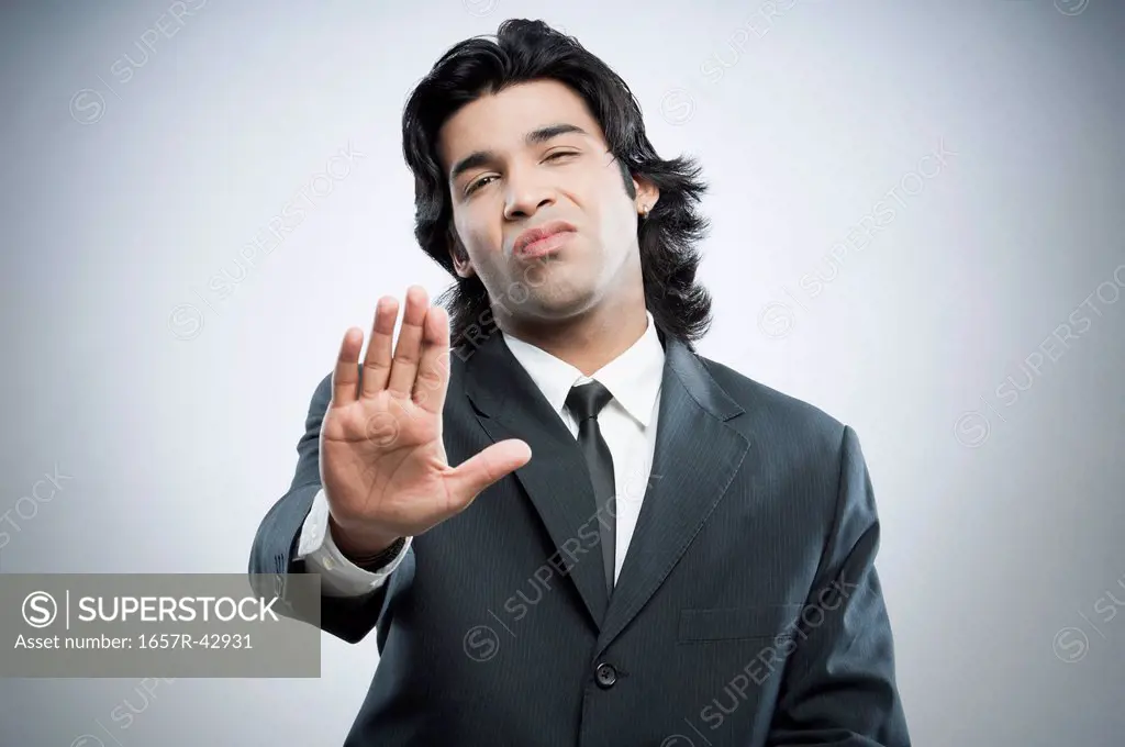 Businessman showing stop gesture