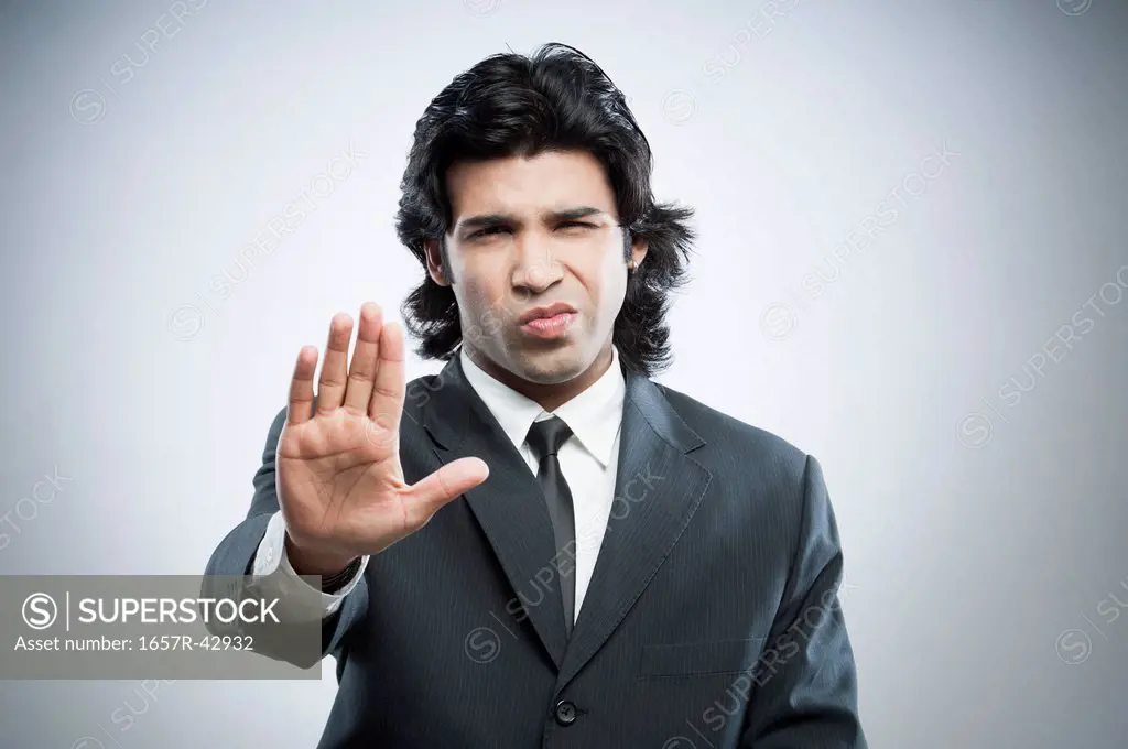 Businessman showing stop gesture