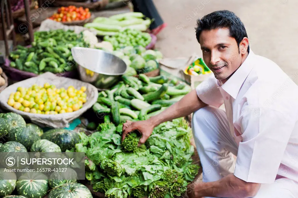 Man buying vegetables from a market stall, Sohna, Gurgaon, Haryana, India
