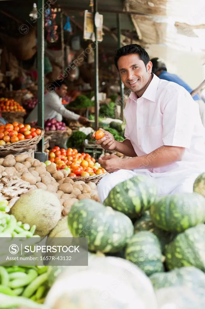 Man buying vegetables from a market stall, Sohna, Gurgaon, Haryana, India