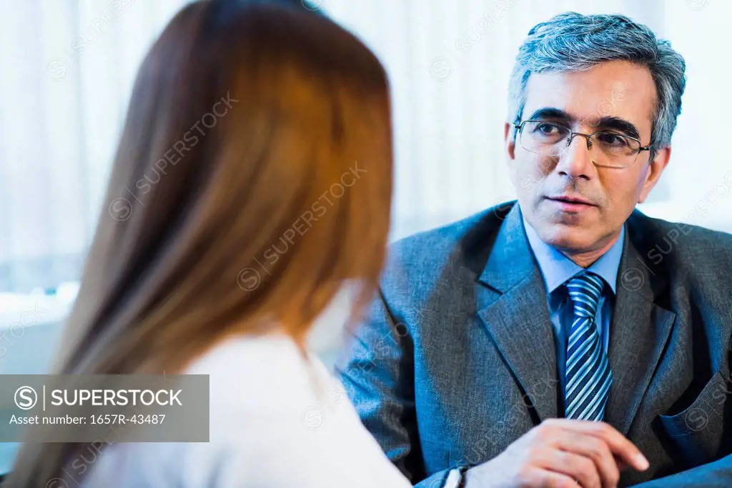 Businessman discussing with a businesswoman