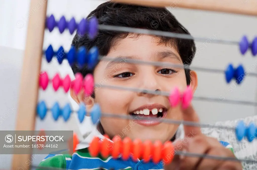 Boy using an abacus