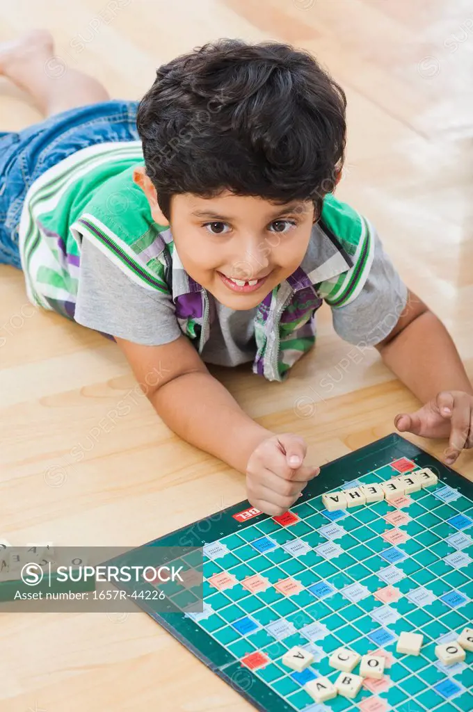 Boy playing crossword puzzle game