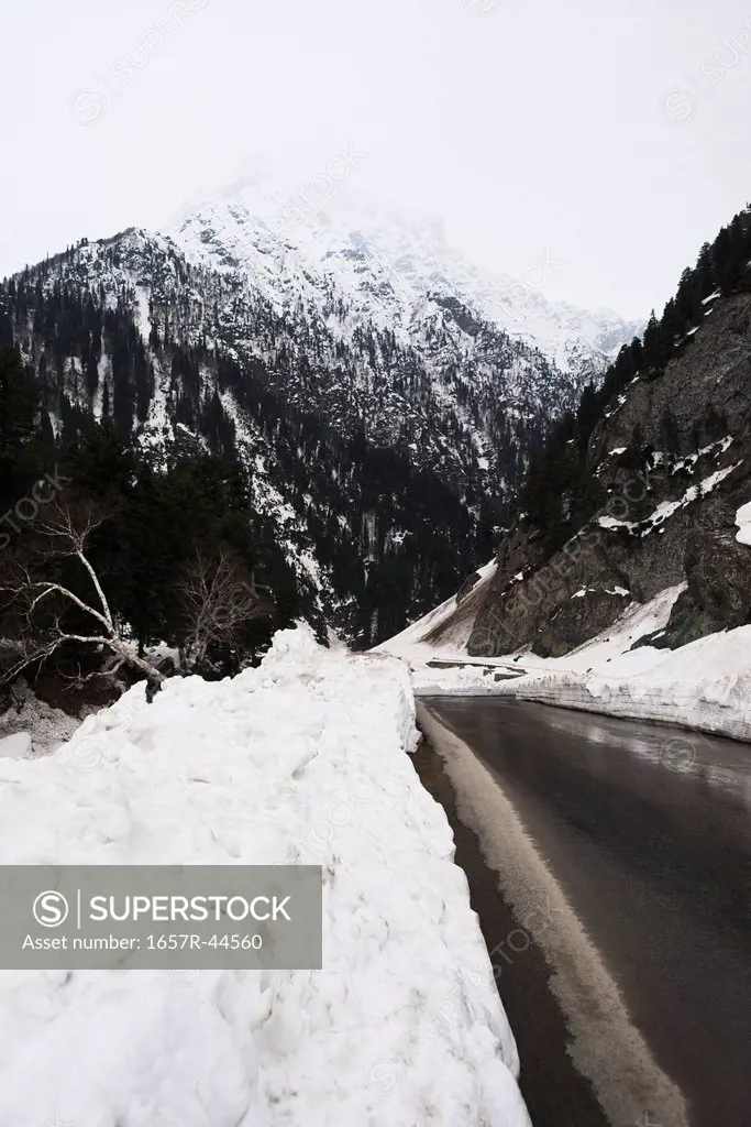 Road passing through a snowy valley, Sonmarg, Jammu And Kashmir, India