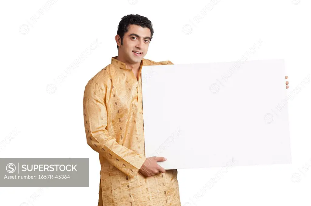 Portrait of a Bengali man holding a placard