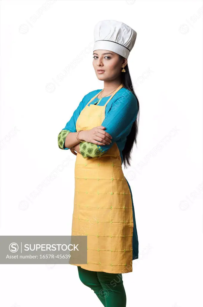 Woman wearing a chef's hat standing with his arms crossed