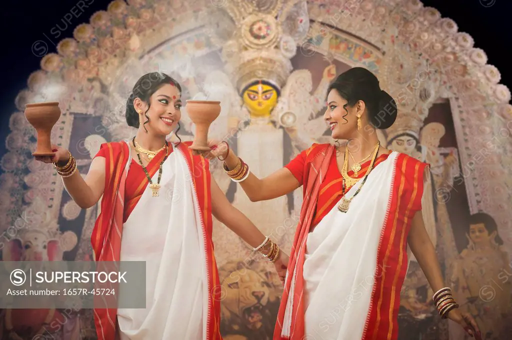 Bengali women performing Dhunachi Dance at Durga Puja