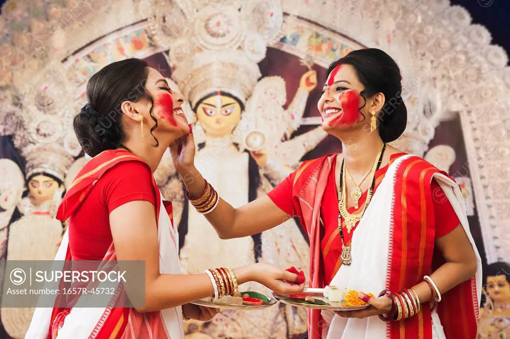 Bengali women celebrating Durga Puja