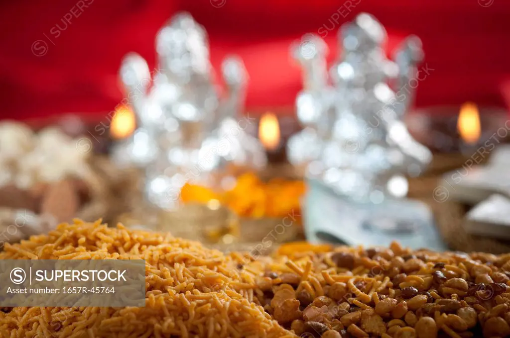 Snacks with idols of Lakshmi and Ganesh during Diwali festival