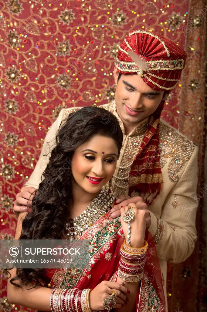 Indian newlywed couple in traditional wedding dress