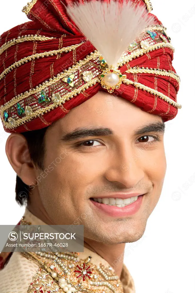 Smiling man in traditional wedding outfit