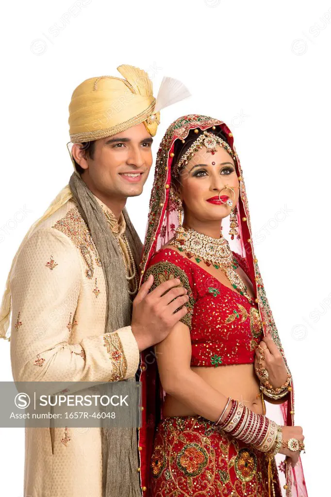 Indian newlywed couple in traditional wedding dress