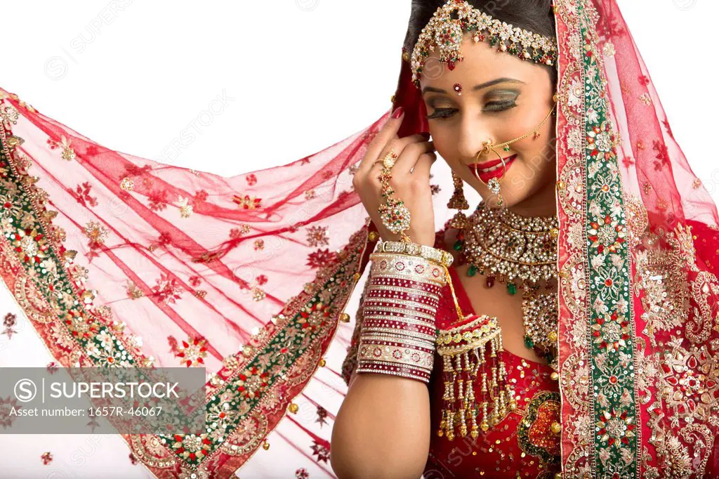 Smiling Indian bride in traditional wedding dress