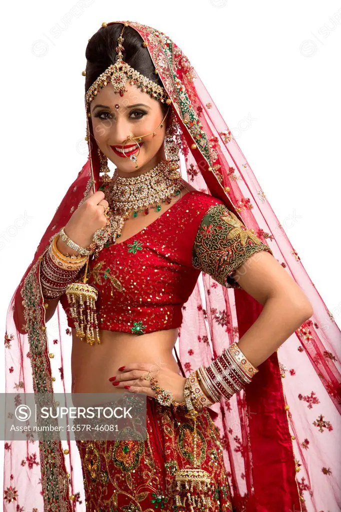 Smiling Indian bride in traditional wedding dress