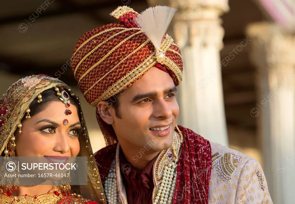Indian bride and groom in traditional wedding dress